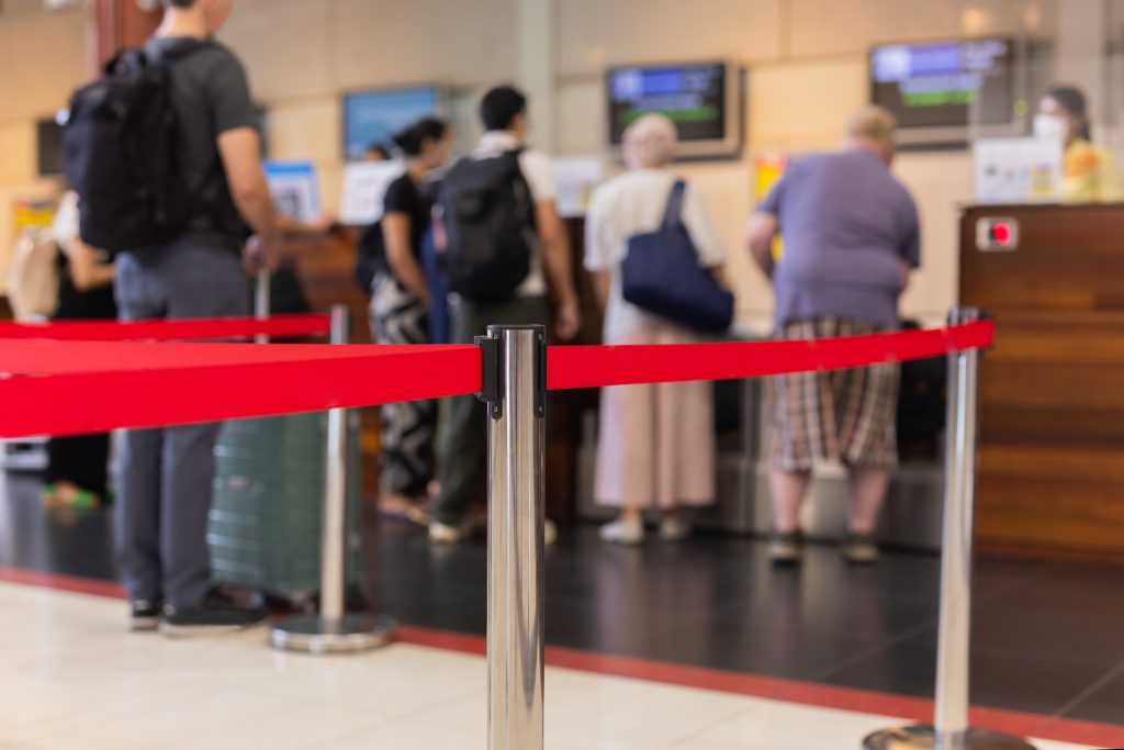 Selected focus on security post with passenger check in at the a